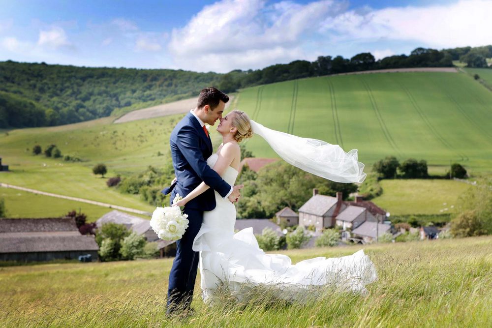 Upwaltham barn sussex wedding on the hill